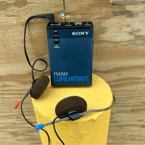 Vintage Sony Walkman SRF-33W AM/FM portable radio.